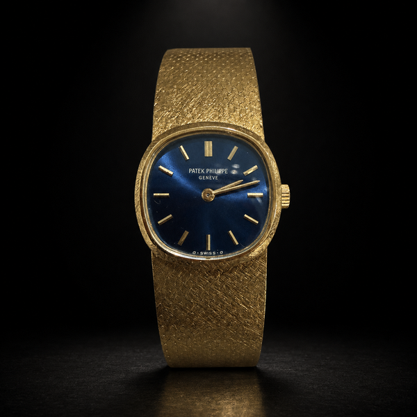 Patek Philippe Golden Ellipse 18K yellow gold blue dial watch on integrated textured gold bracelet