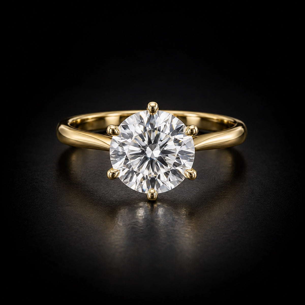 Classic round solitaire engagement ring in 18kt yellow gold