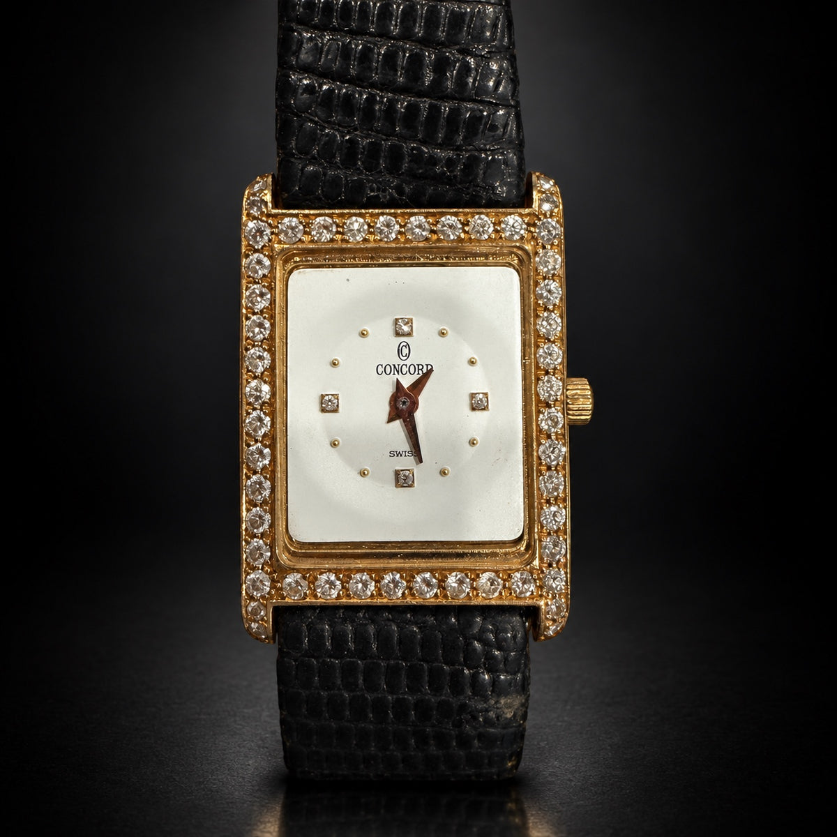 Concord rectangular gold-tone Swiss watch with stone-set bezel and black strap