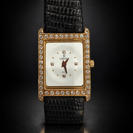 Concord rectangular gold-tone Swiss watch with stone-set bezel and black strap