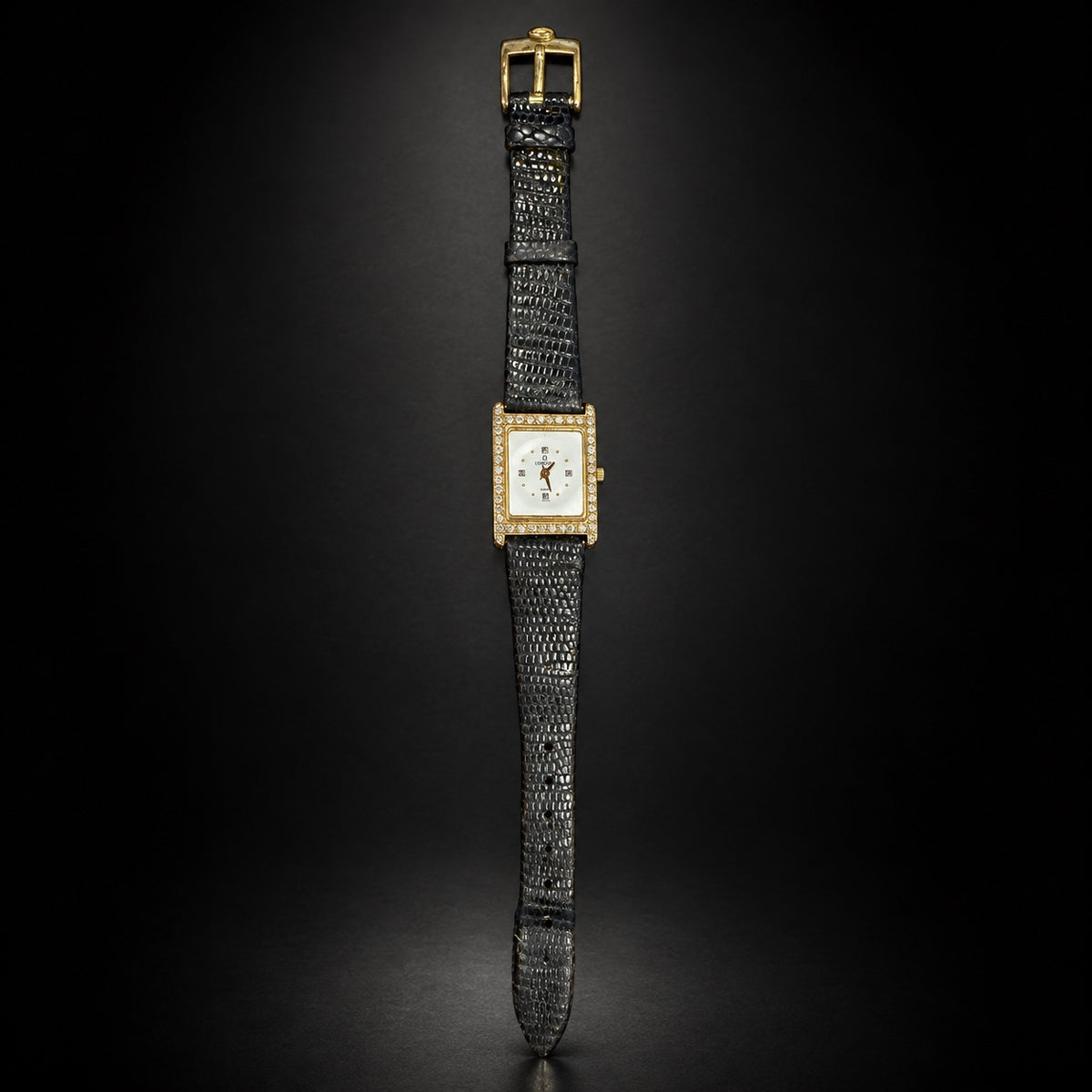 Full view of Concord rectangular gold-tone Swiss watch with black strap