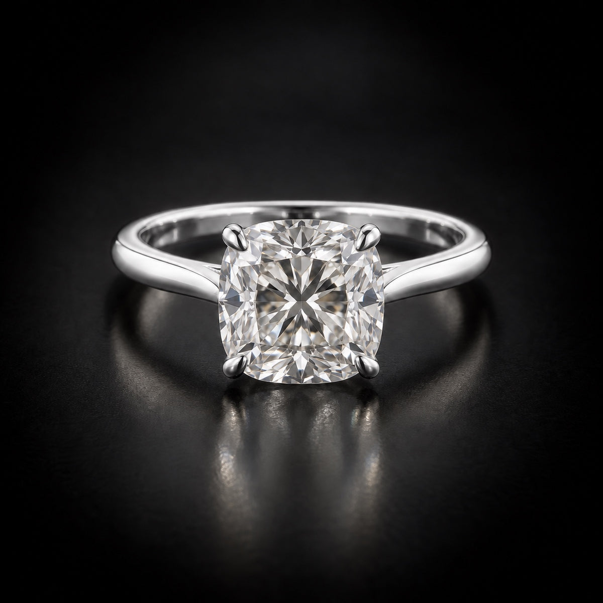 Cushion-cut solitaire engagement ring in platinum
