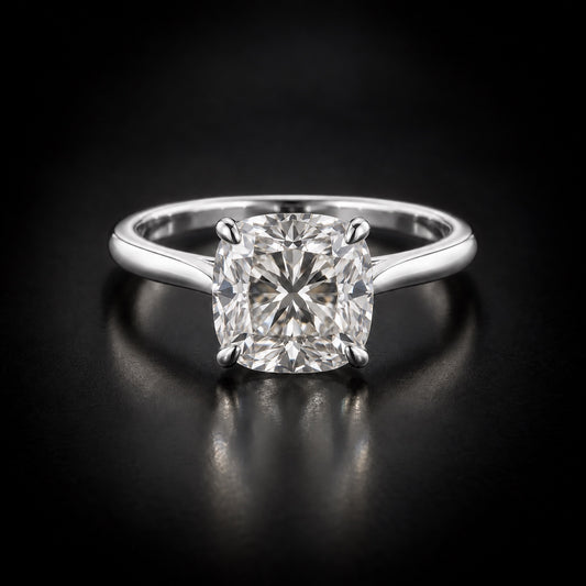 Cushion-cut solitaire engagement ring in platinum