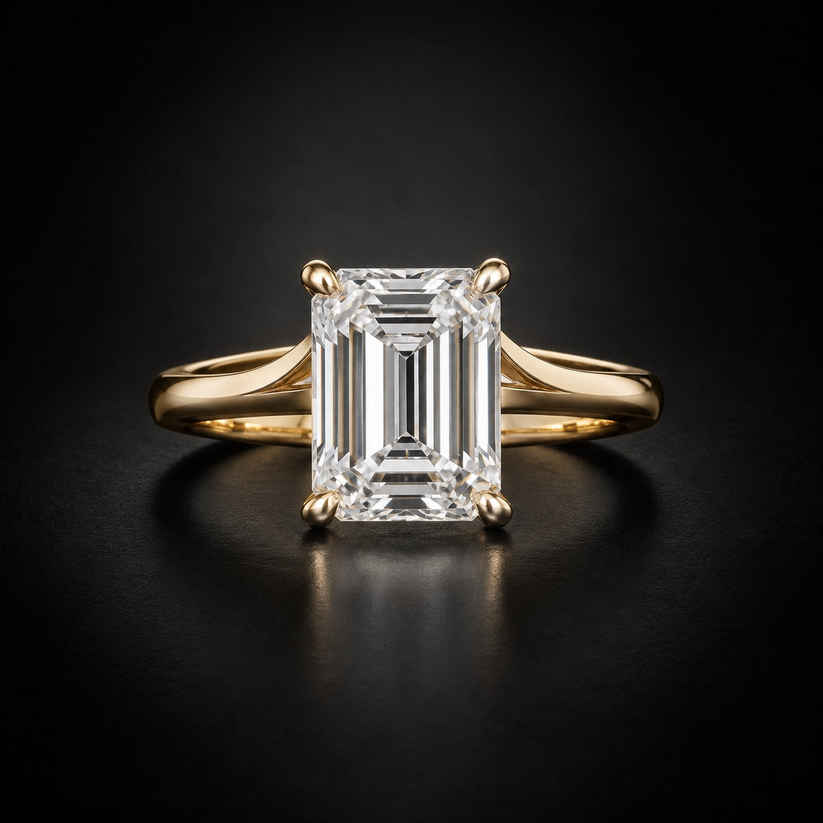 Emerald-cut solitaire engagement ring in 18kt yellow gold