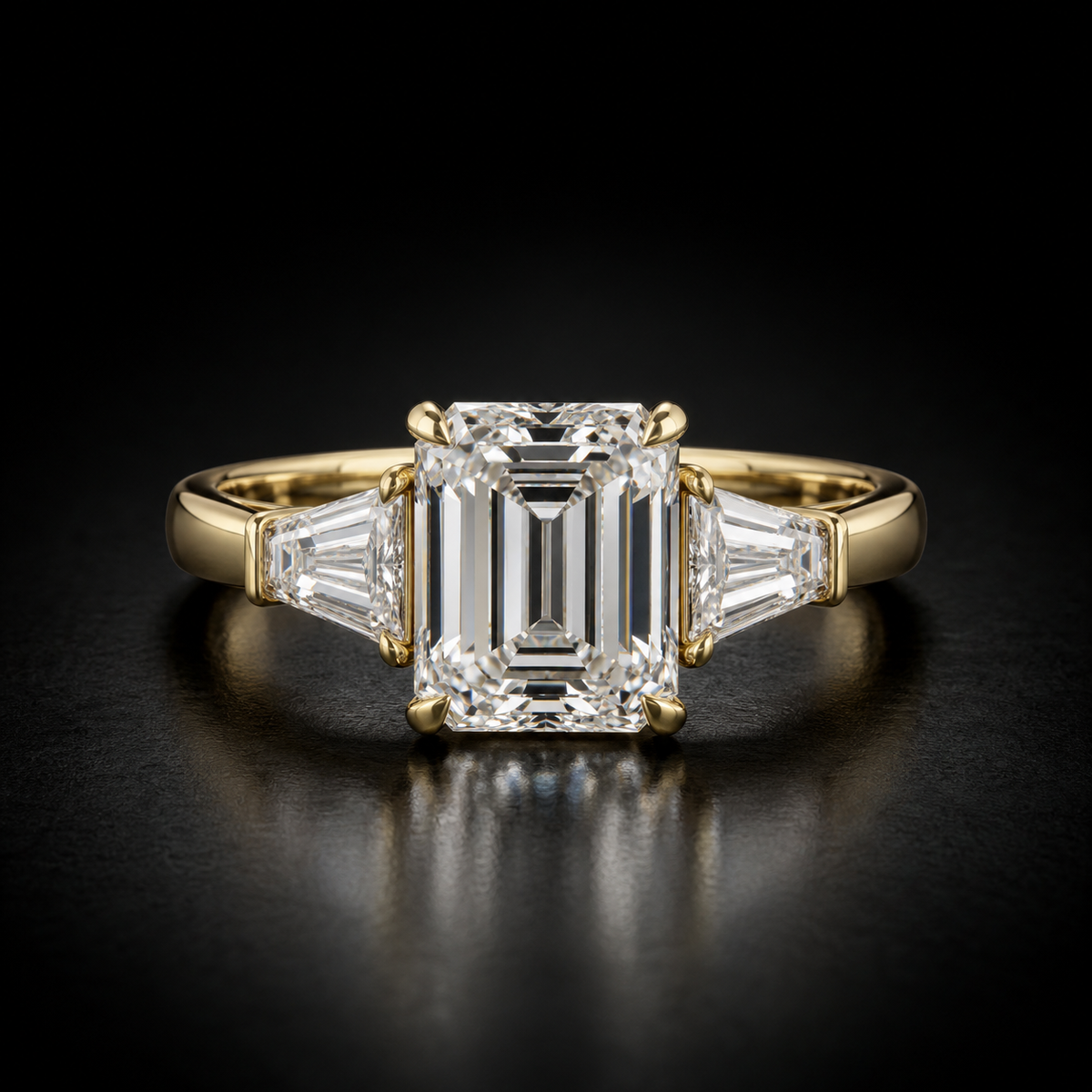 Emerald-Cut Three-Stone Engagement Ring in 18kt yellow gold