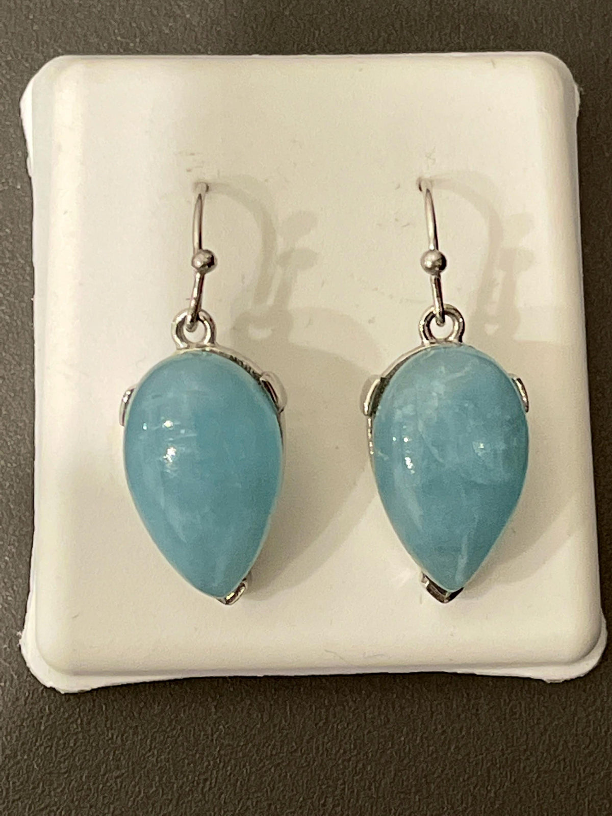 Sterling Silver Dangle and Drop Light Blue Aquamarine Earrings in a Pear Shape