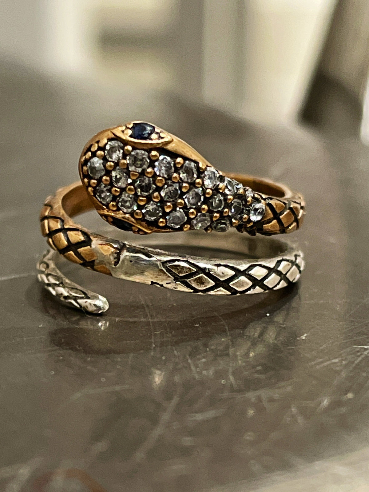 Whimsical Sterling Silver Two Tone Snake Ring with Cubic Zirconias and Blue Stone Eyes