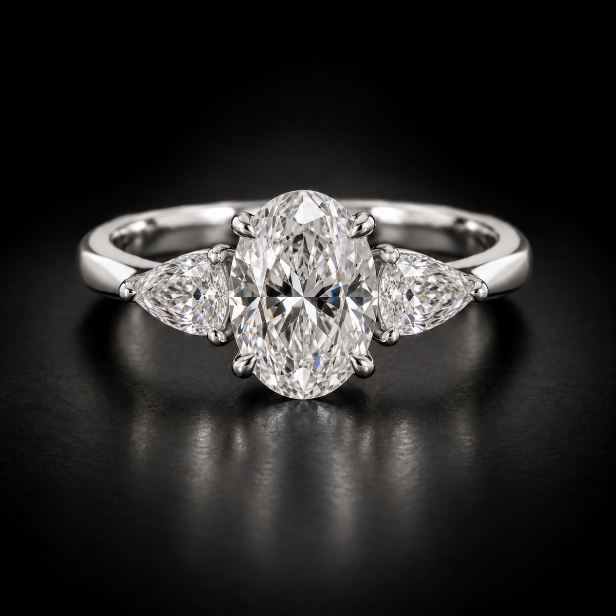 Oval and Pear Three-Stone Engagement Ring in platinum