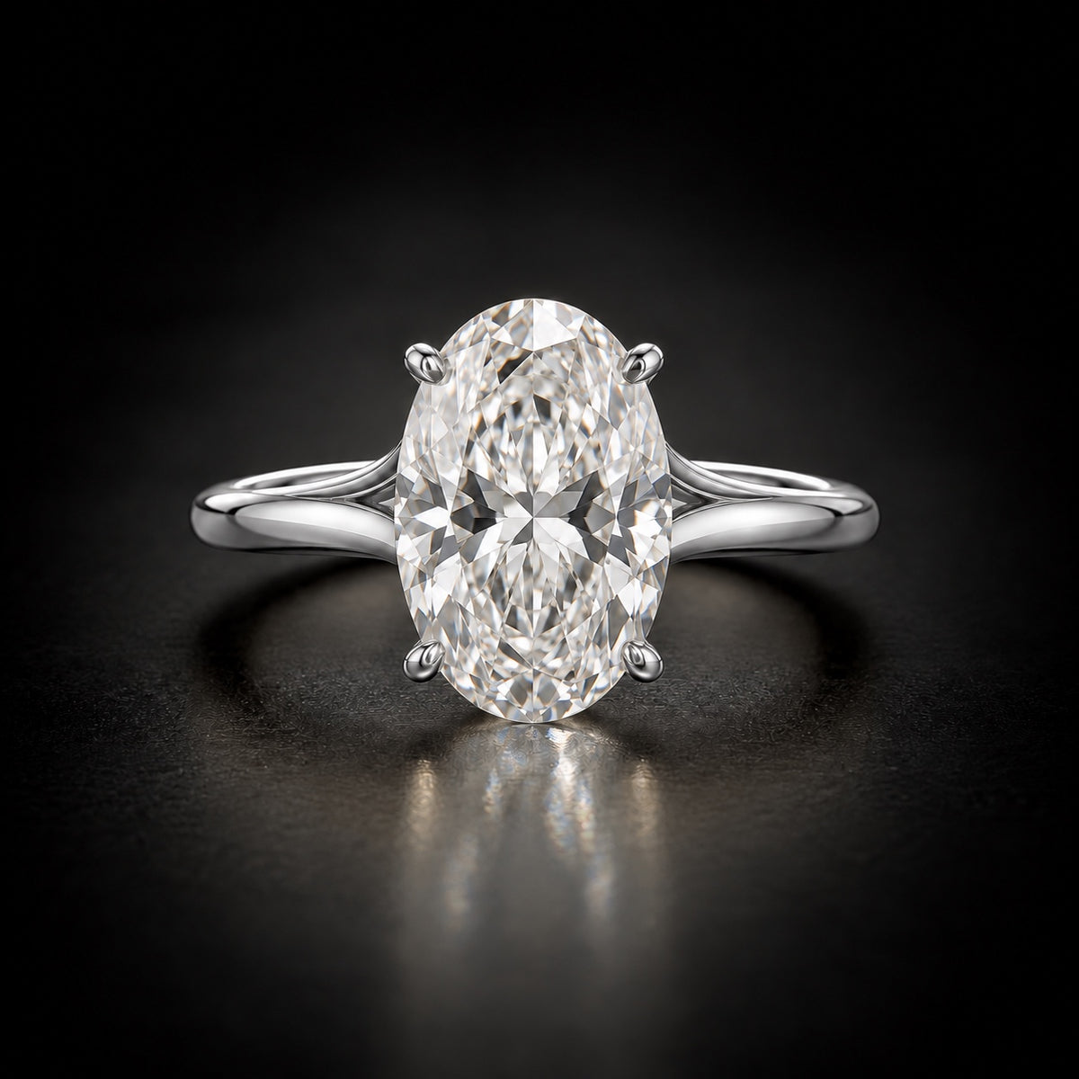 Four-prong oval solitaire engagement ring in platinum